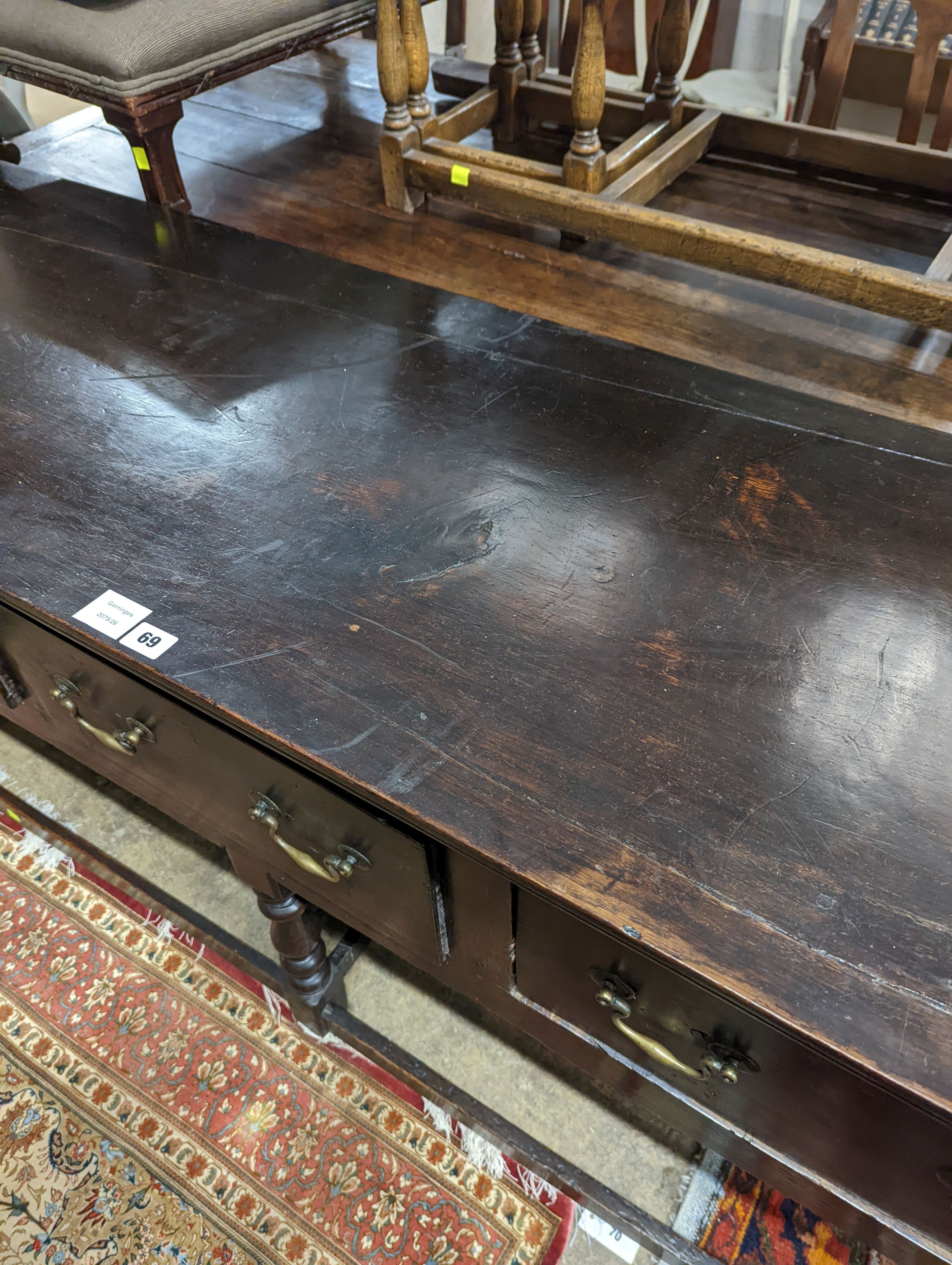 A George III oak low dresser base, length 175cm, depth 51cm, height 82cm